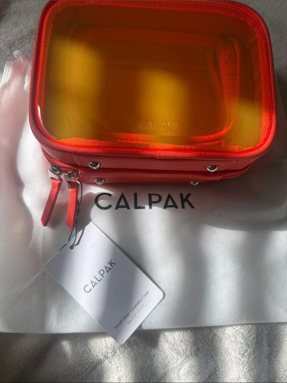 Calpak Small Clear Cosmetic Case in Papaya Limited Edition